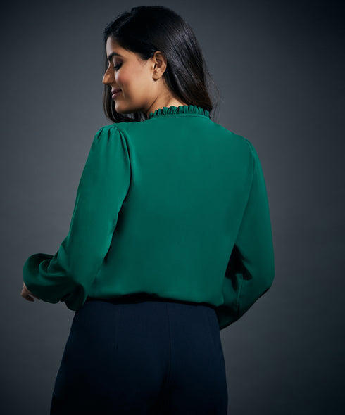 Side smocking done solid green top